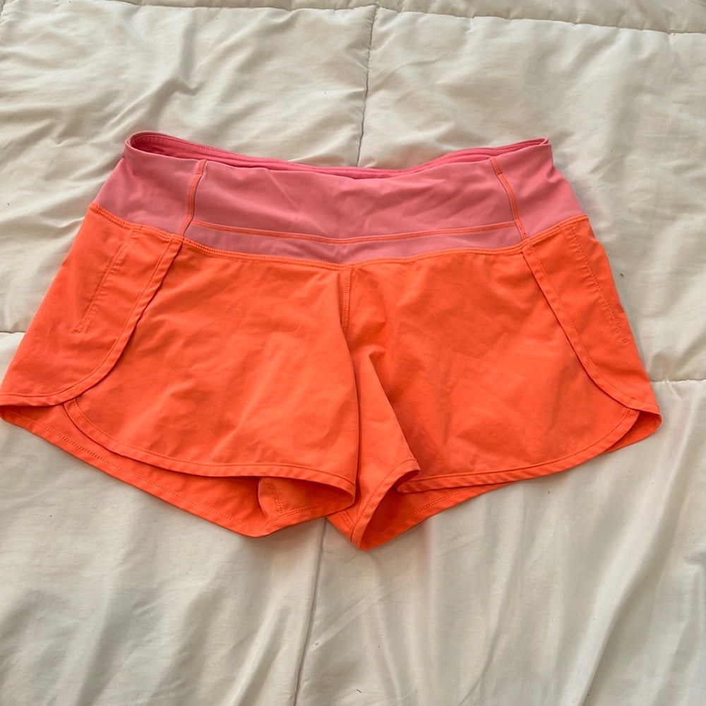 Coral orange pink lululemon run times shorts. Some blue marks, see pics